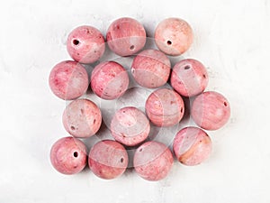 Beads from natural pink rhodonite gemstone photo