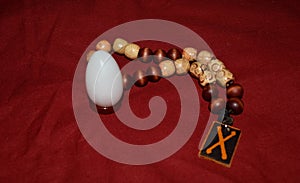 Beads in rosary for reading prayers and mantras with yoni egg from white agate