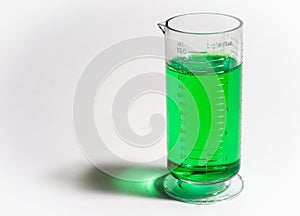 Beaker or flask with green liquid on white background