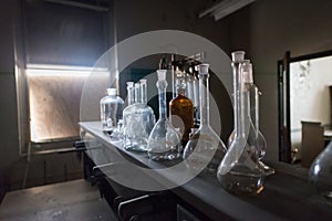 Beakers in an abandoned science classroom