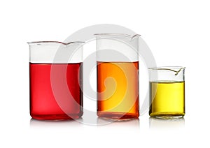 Beakers with color liquid on white. Solution chemistry