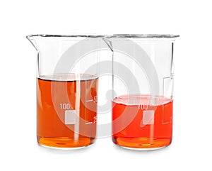 Beakers with color liquids on white background