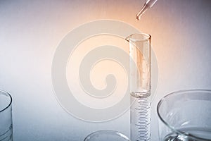 Beakers or test tubes on empty background, science laboratory equipment concept