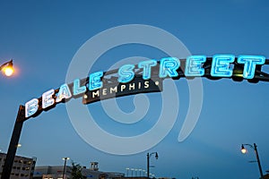 Beale Street Memphis blue neon sign lit up at dusk
