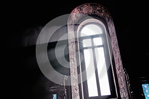 A beam of light through the window in the church