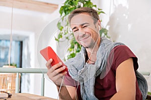 Beaming freelancer feeling truly satisfied using new music app