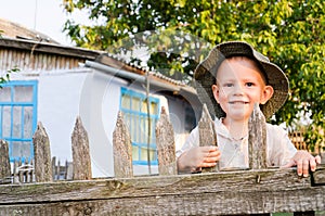 Beaming little boy in a summer photo