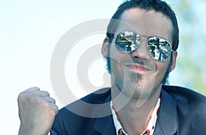 Beaming Young Man with Sunglasses