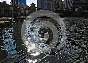 Beams of light glimmer on the Chicago River during a bright spring afternoon.