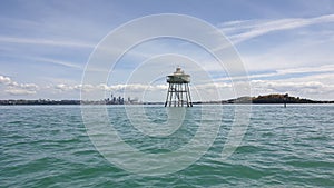 Bean Rock lighthouse with Auckland city in the background