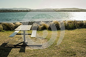 Beanch at the lawn and the river