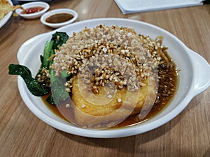 Beancurd with fried salted vegetables and cai Poh toppings