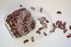 Beans in a bowl on a white background