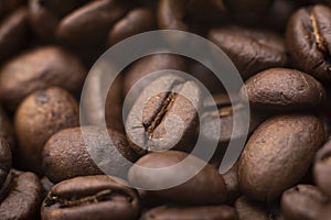 Beans of coffee. Roasted coffee beans, coffee, aromatic food and drinks, close up