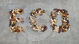 Beans, lentils, mung bean, peas are laid out on a on the concrete background, in the form of the inscription . Vegetarian Food