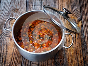 Beans stew on a wooden board