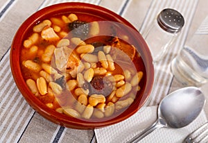 Beans stewed with pork, blood sausage and chorizo in clayware