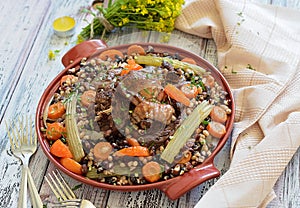 Beans with vegetables and meat on a plate