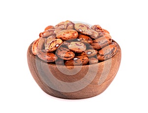 Beans in wooden bowl, isolated on white background.