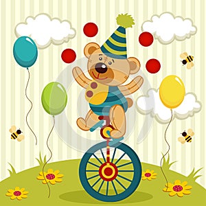 Bear clown juggles and rides a unicycle