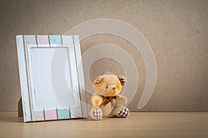 Bear doll with photo frame