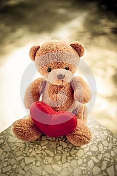 the bear doll and red heart