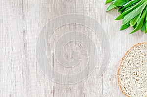 Bear garlic on wooden table