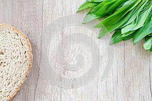 Bear garlic on wooden table