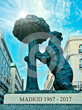 The bear symbol of Madrid. Statue of the Bear and the Strawberry Tree Oso y el Madrono in Puerta del Sol Square in Madrid Spain photo