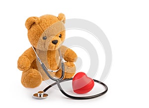 Bear toy and stethoscope. pediatrics medical concept isolated white