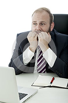 Beard business man fear behind laptop at desk