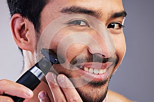 Beard hair trimmer, happiness and man portrait for bathroom shaving, blade grooming or morning beauty routine. Studio