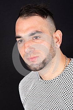 Beard man look down side portrait in black background