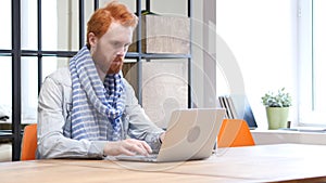 Beard Man Working on Laptop, Designer