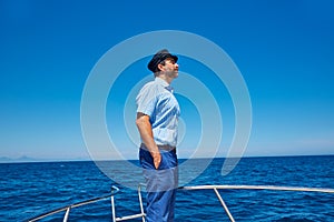 Beard sailor cap man sailing sea ocean in a boat