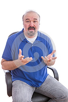 Bearded Adult Guy on a Chair Questioning Something