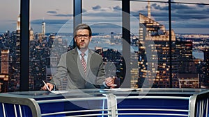 Bearded anchor man talking at newscast multimedia channel closeup. Daily news