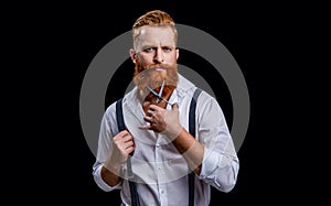 bearded barbershop man in studio. barbershop man with scissors. photo of barbershop man