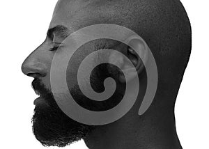A bearded bold man with closed eyes black and white profile portrait