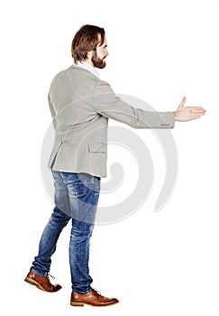 Bearded businessman giving hand for an handshake. human emotion