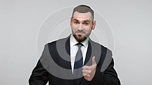 Bearded businessman showing thumb up, recommend service.