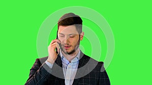 Bearded businessman talking on phone, manager look up serious answer boss questions on mobile call on a Green Screen