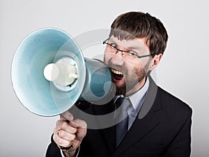 Bearded businessman yelling through bullhorn. Public Relations. man expresses various emotions. photos of young