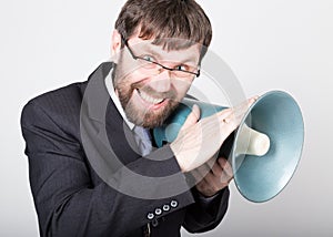 Bearded businessman yelling through bullhorn. Public Relations. man expresses various emotions. photos of young