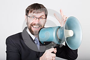 Bearded businessman yelling through bullhorn. Public Relations. man expresses various emotions. photos of young