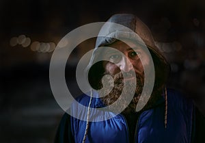 Bearded caucasian man in blue sportswear looks at camera. Big beard photo