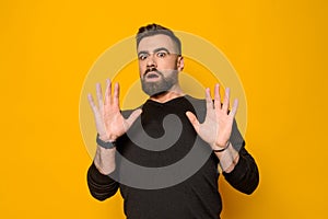 Bearded confident man expresses amazement