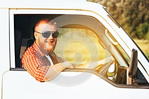 Bearded driver driving his camper van