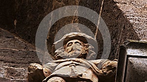 Bearded figure on top of the main entrance