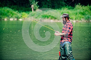 Bearded fisher. Man fishing. Perfect weekend. Fishing skills. Fisher fishing equipment. Active sunny day. Good profit